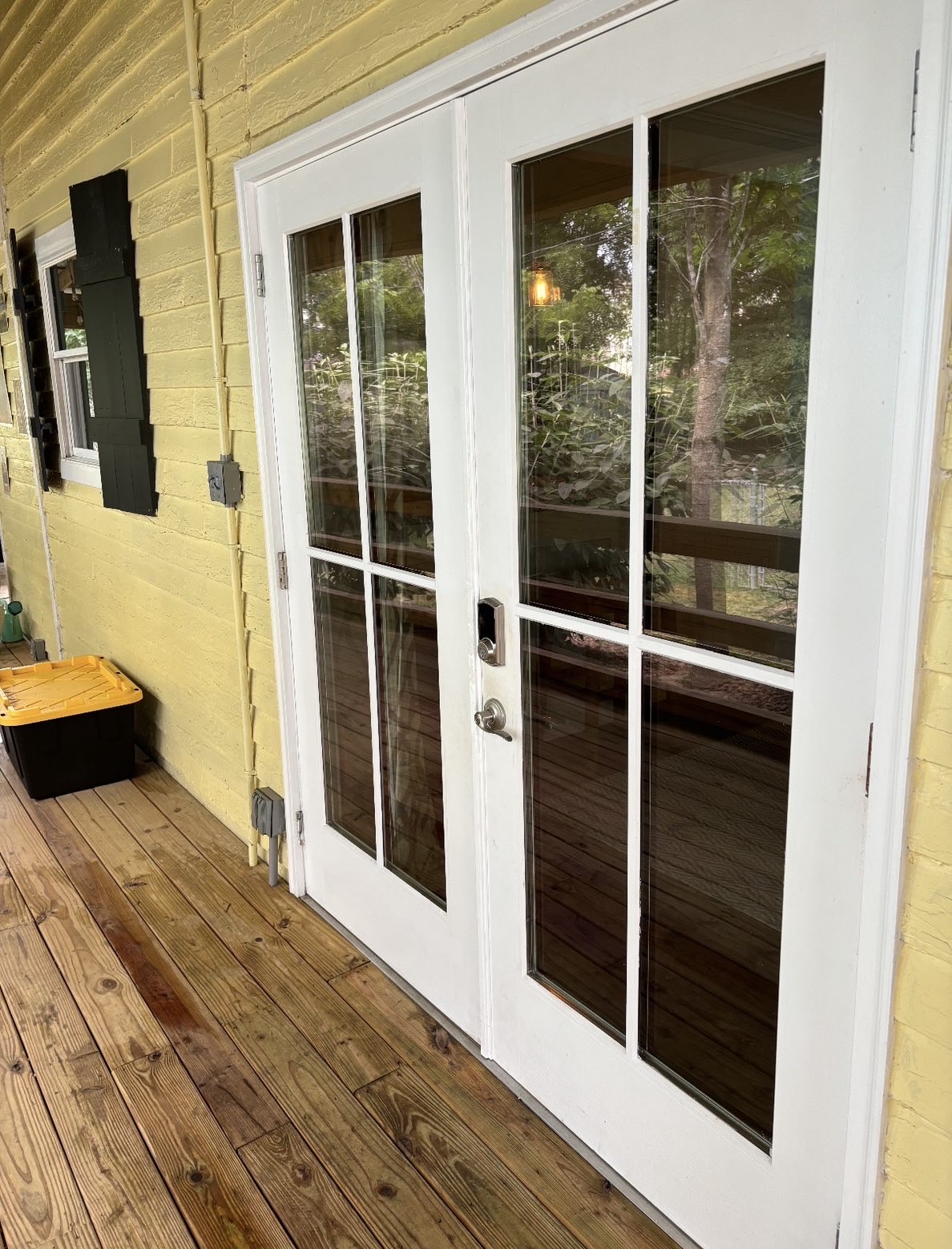 Freshly cleaned French doors on a back porch
